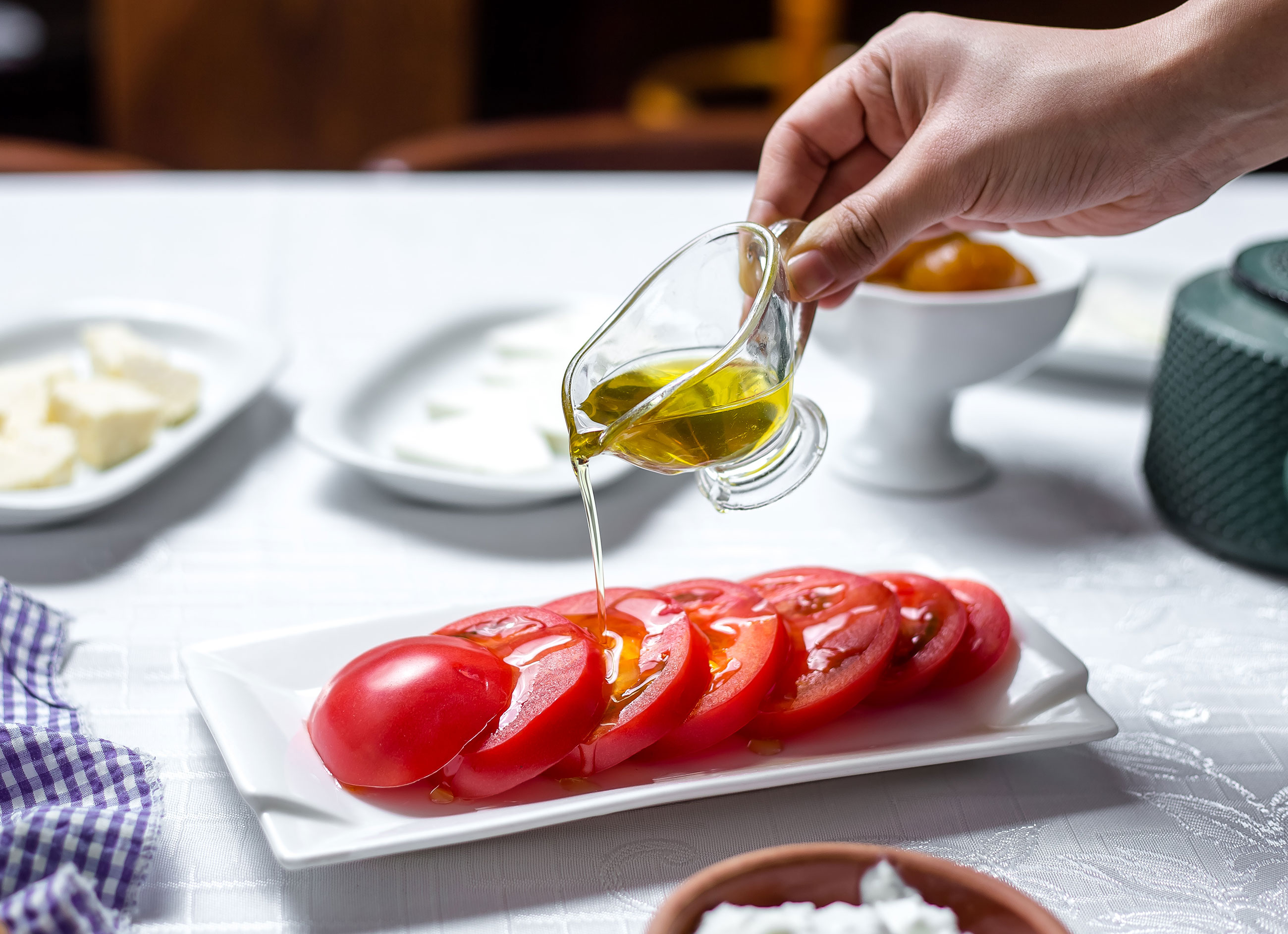 extravirgin olive oil from europe on a table with olives